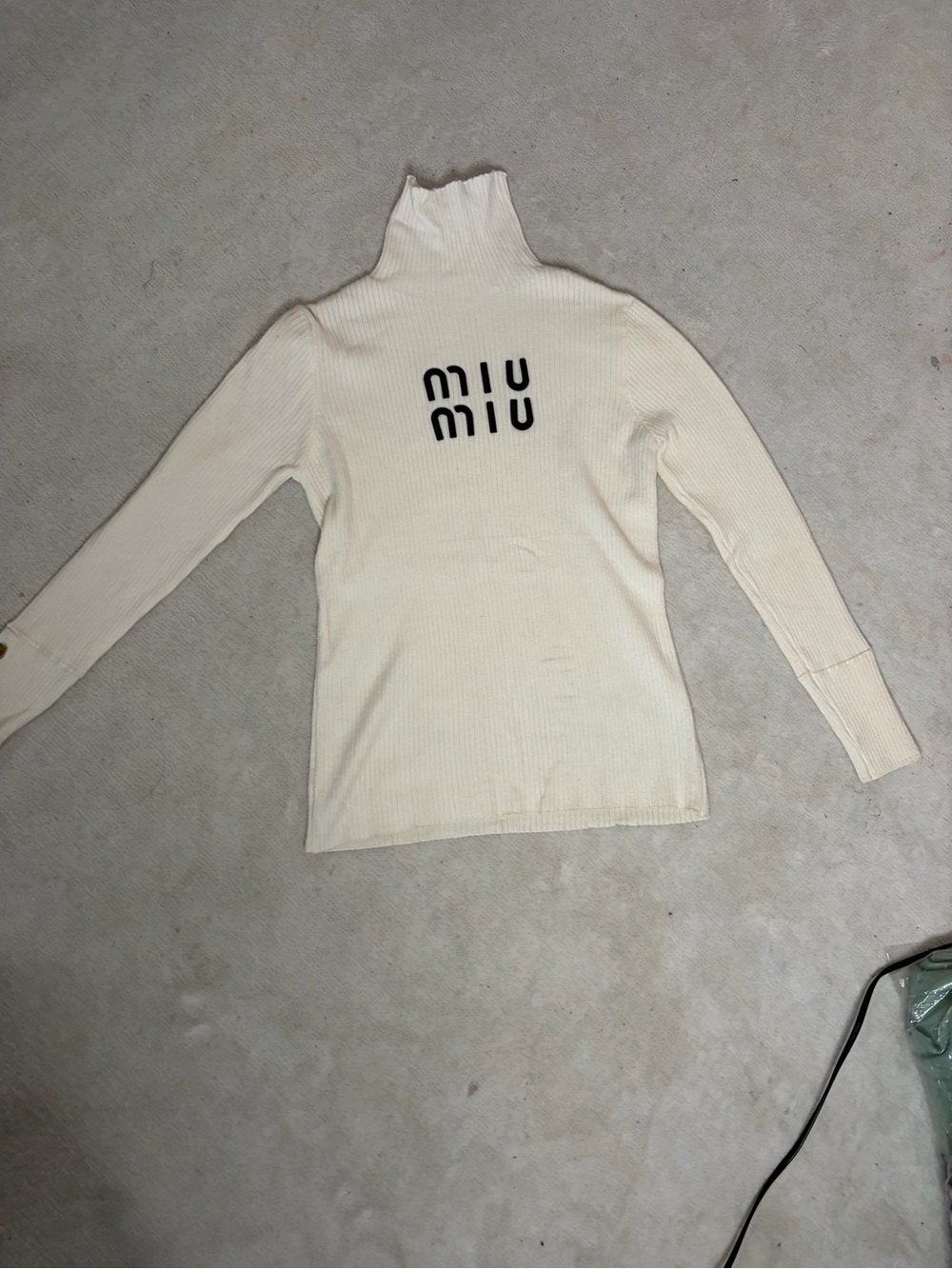 A long sleeve sweater with Cream Ribbed Turtleneck Unbranded/16x24in/